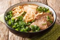 Lanzhou beef noodle soupÃÂ is a type of Chinese ramen noodle soup with beef slices served on the top closeup in a bowl. horizontal Royalty Free Stock Photo